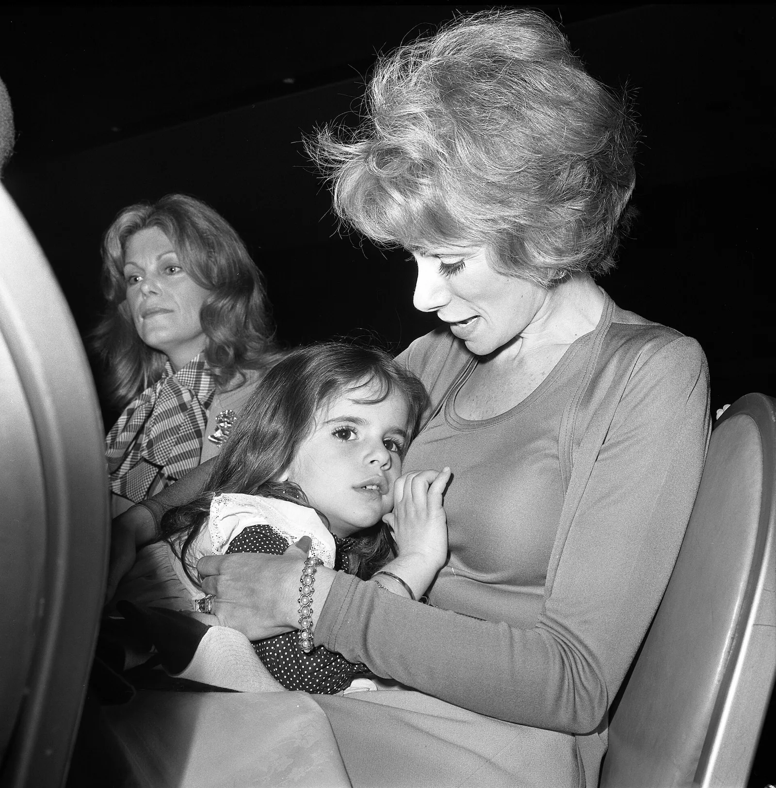 Joan Rivers holding her young daughter Melissa at a 1973 fashion show