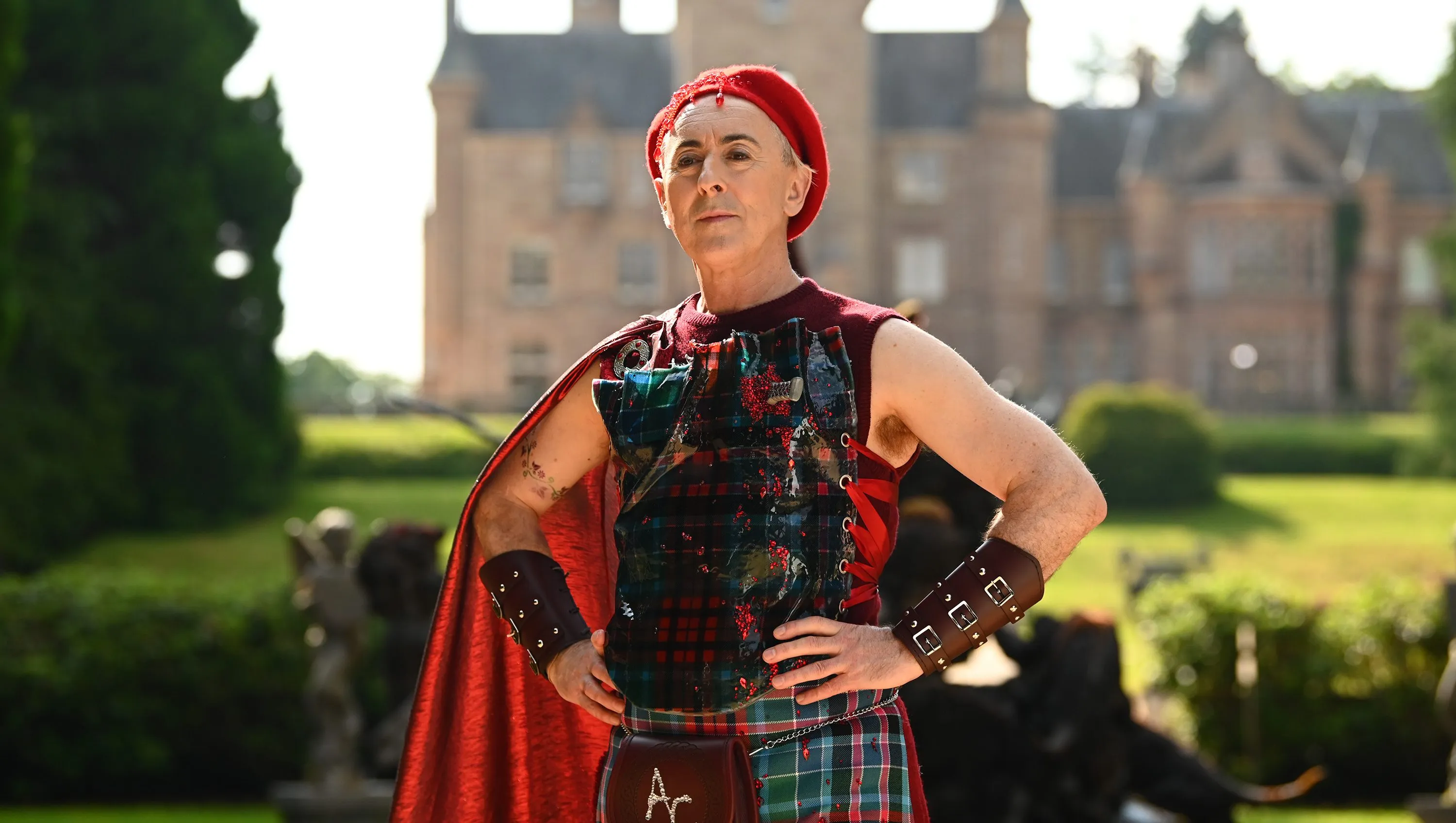 Alan Cumming hosting The Traitors in his iconic tartan fashion