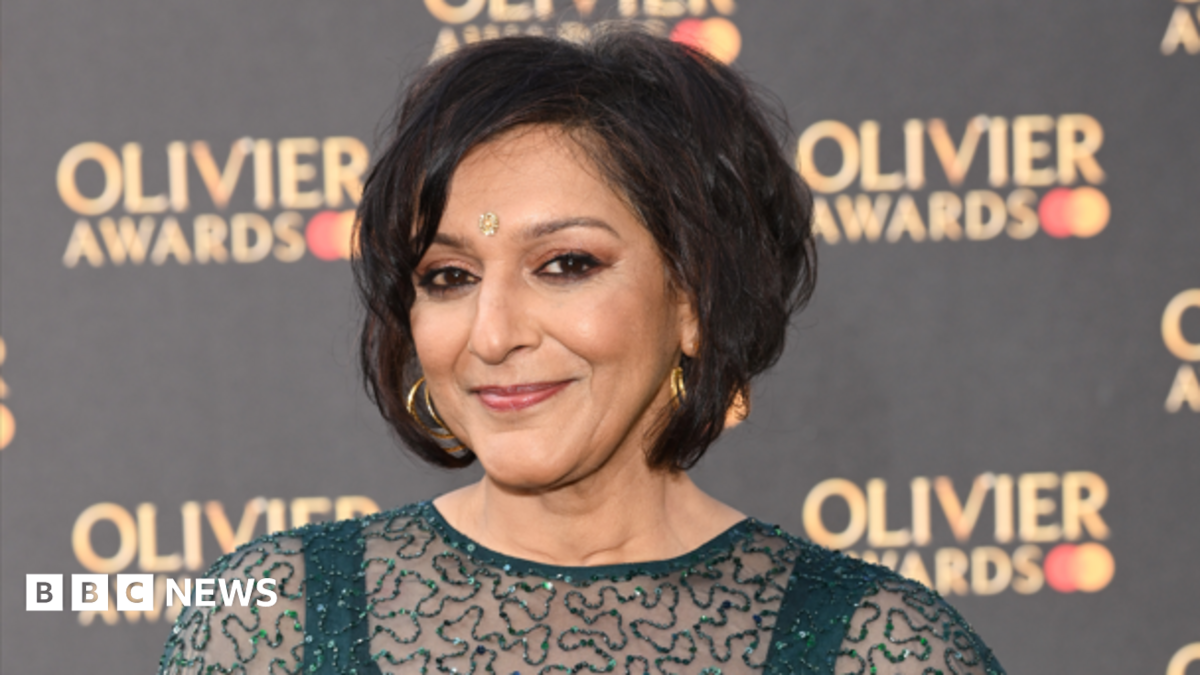 Dame Meera Syal has short wavy dark brown hair and is dressed in a teal green sparkly dress and has gold hooped earrings on. She is standing against a black background with the 'olivier awards' logo on.