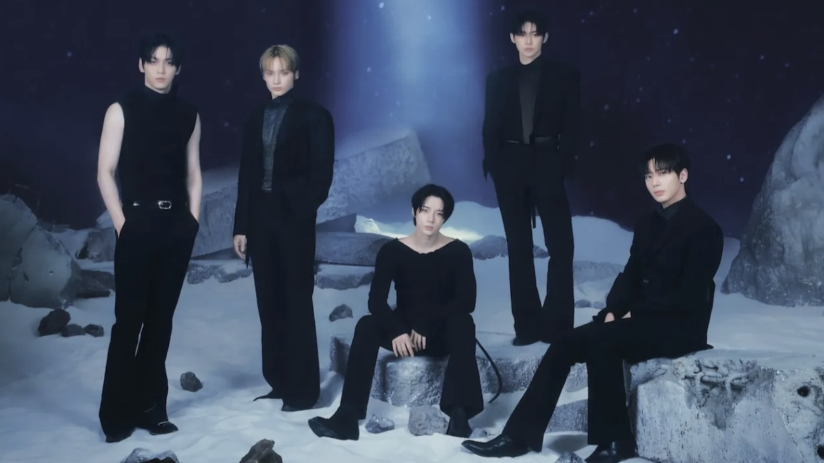 TOMORROW X TOGETHER performing live on stage during a concert