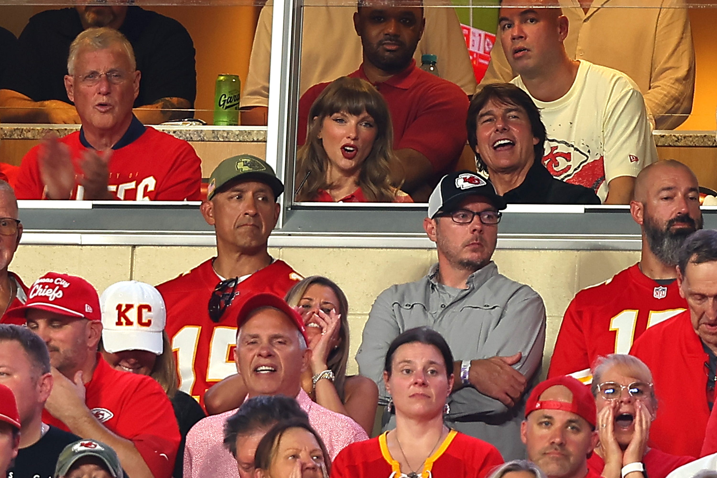 Tom Cruise and Taylor Swift talking at a Kansas City Chiefs football game
