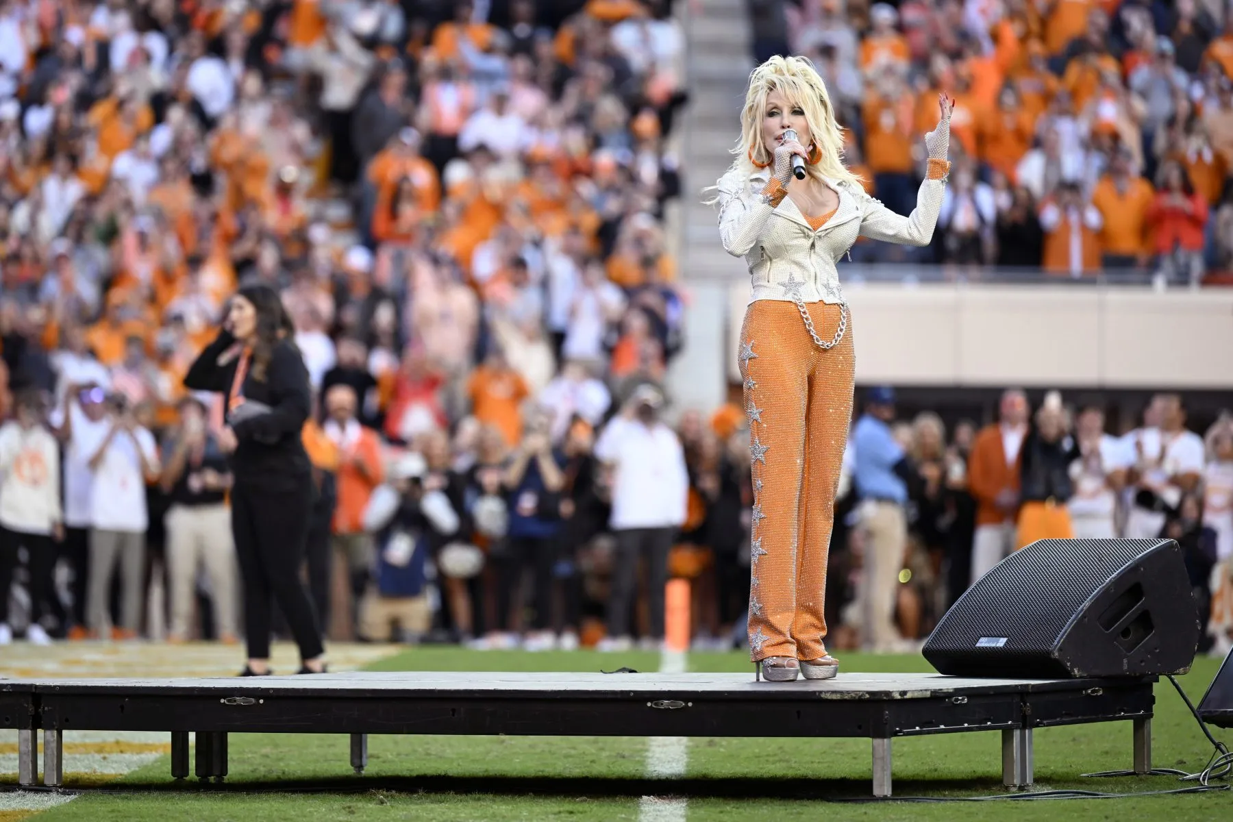 Dolly Parton speaks to the crowd between the first and second quarter at Neyland Stadium on November 18, 2023 in Knoxville, Tennessee.