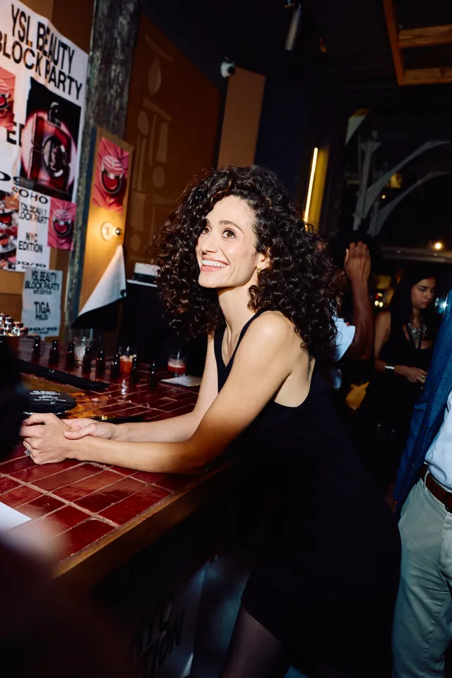 Image may contain Emmy Rossum Urban Adult Person Curly Hair Hair Wedding Face and Head