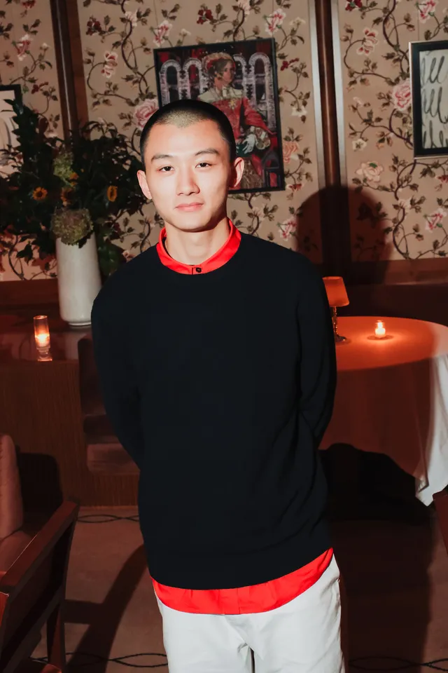 Image may contain Raymond Tam Adult Person Face Head Photography Portrait Crew Cut and Hair