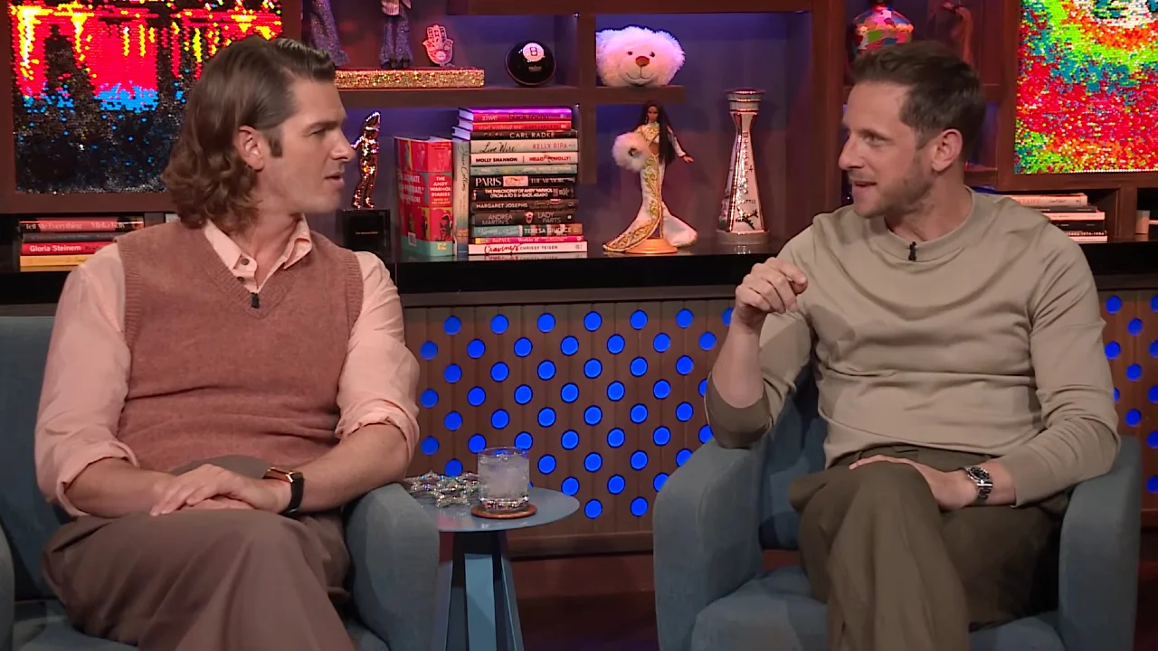 Andrew Garfield and Jamie Bell smiling during a talk show appearance