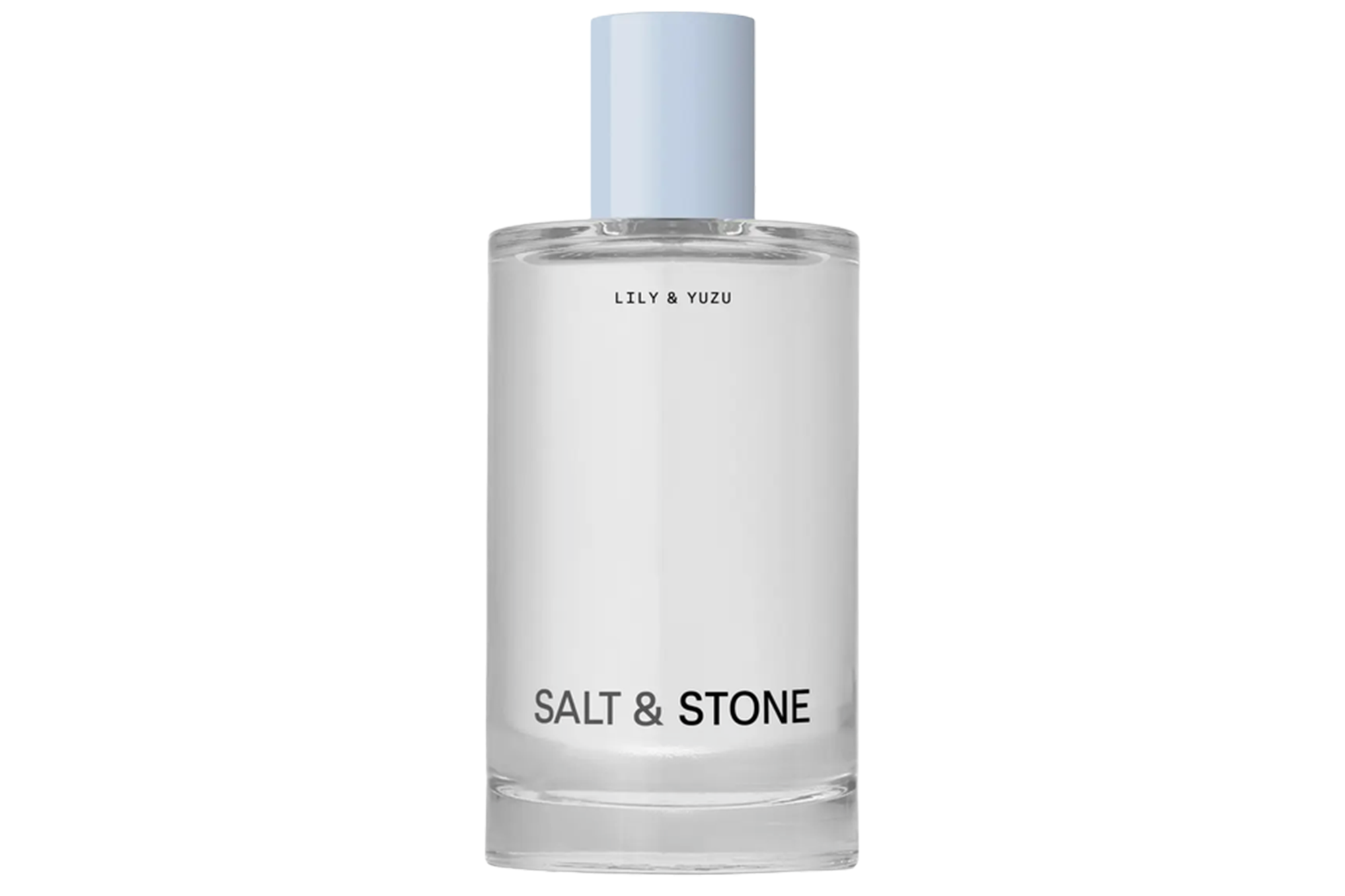A clear glass bottle of Salt & Stone Lily & Yuzu fragrance with a light blue cap.