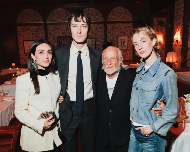 Image may contain Rebecca Thomas Susan Eisenberg Person Photobombing Blazer Clothing Coat Jacket and People