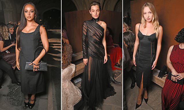Emma Corrin wearing a sheer black gown at the Alexander McQueen London Fashion Week show