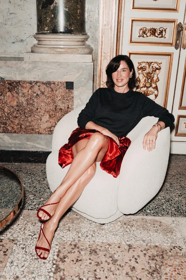 Image may contain Luisa Ranieri Person Sitting Adult Furniture Clothing Footwear and Sandal