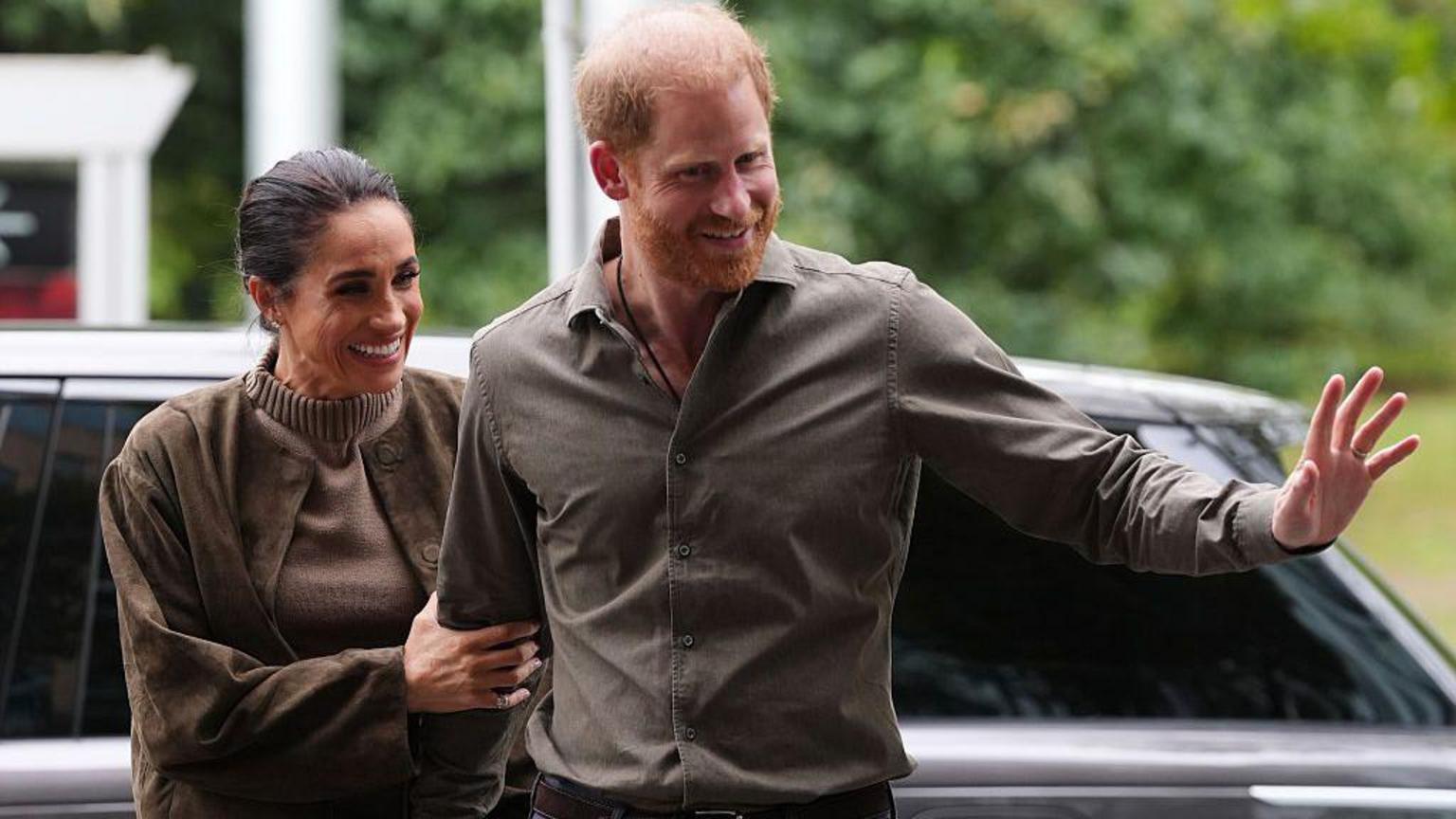 Prince Harry and Meghan Markle standing together at a formal public event