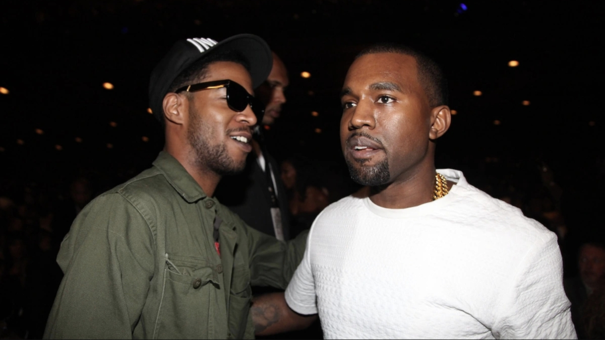 Kid Cudi and Kanye West performing on stage during a concert