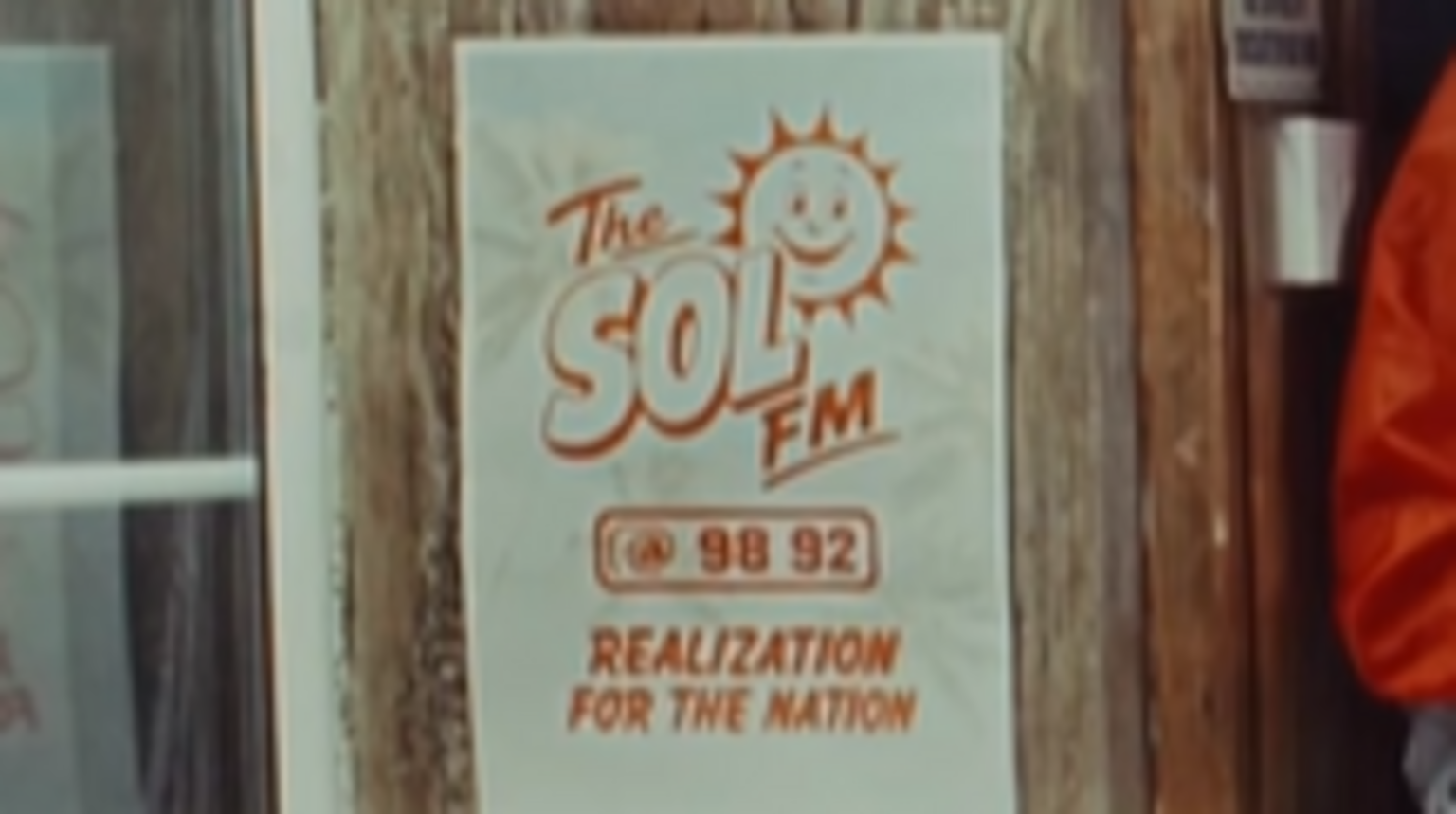 Poster advertising Sol FM 98 92 that also says Realization for the Nation