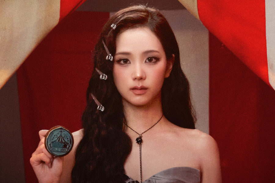 Jisoo performing on stage during a television music broadcast