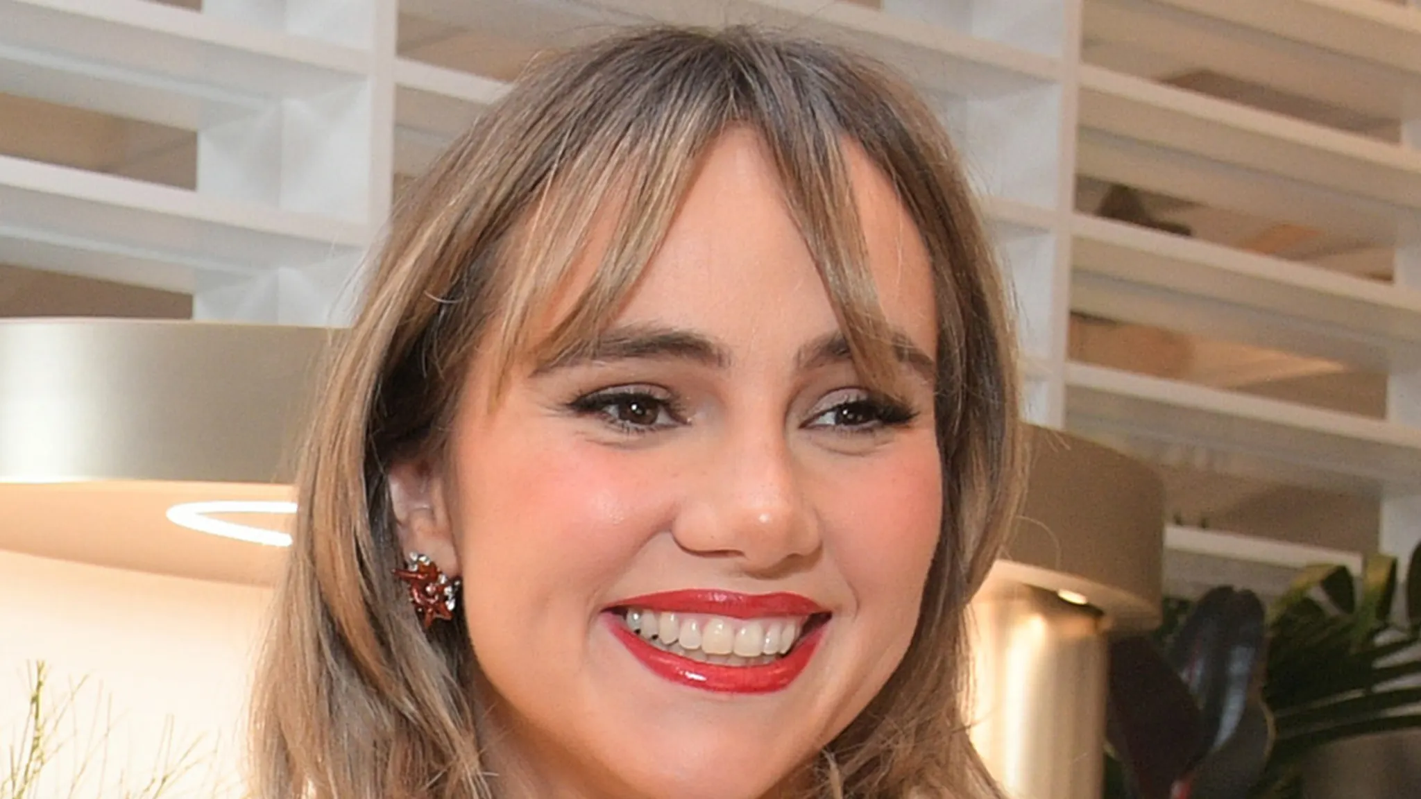 Suki Waterhouse posing at an event