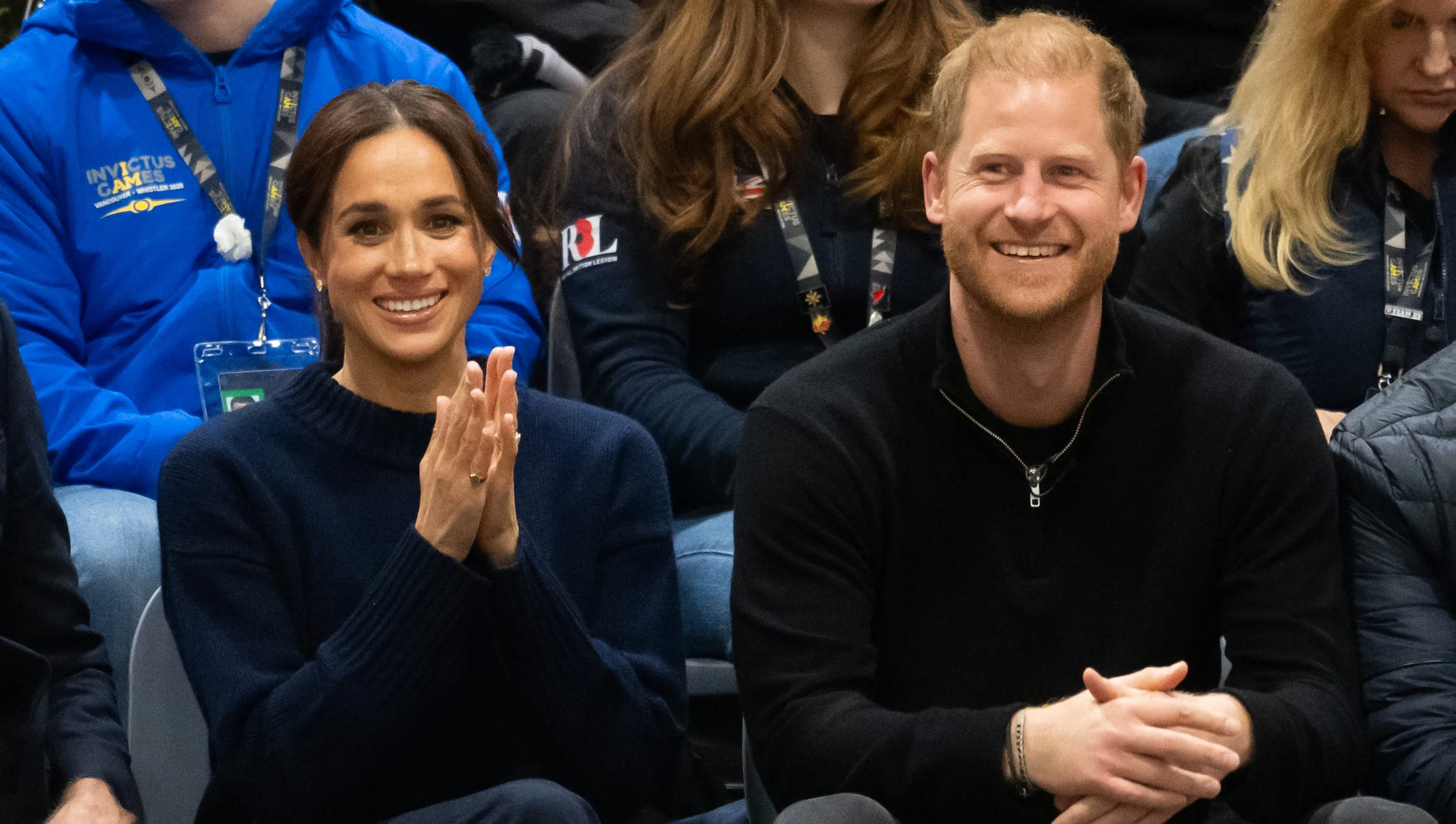 Prince Harry and Meghan Markle looking serious during a public appearance
