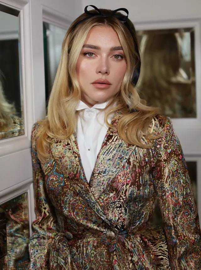 Image may contain Florence Pugh Blonde Hair Person Formal Wear Adult Face Head Photography and Portrait