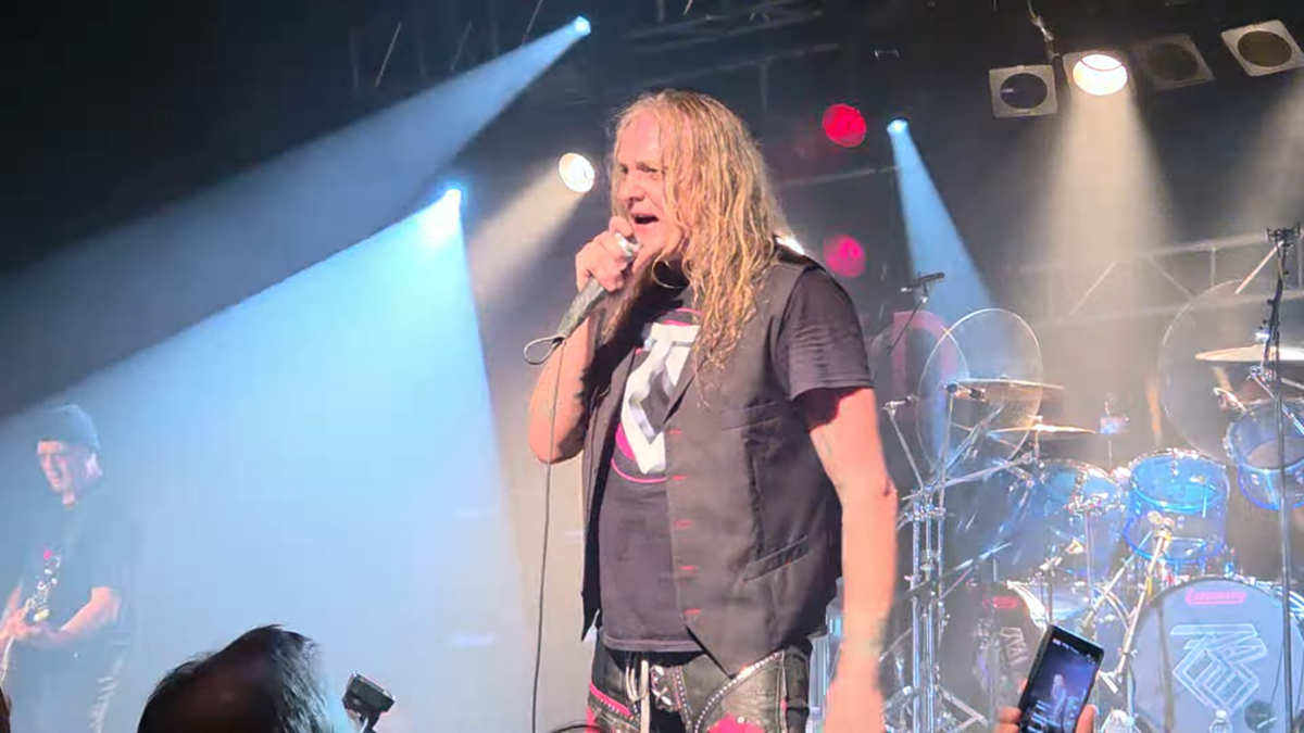 Sebastian Bach singing on stage with Twisted Sister in New Jersey