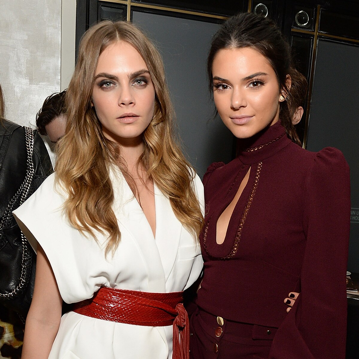 Kendall Jenner and Cara Delevingne posing together at a fashion event