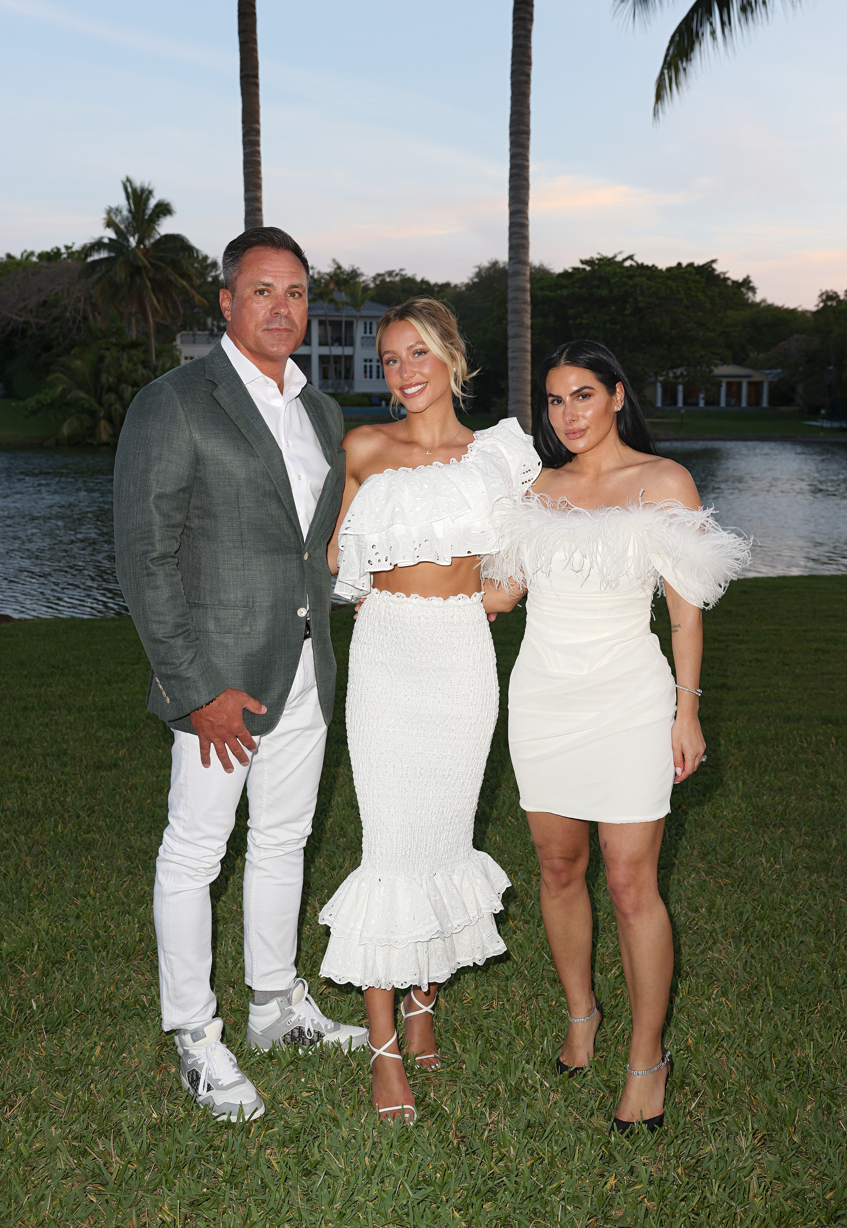Thomas "TJ" Earle, Alix Earle and Ashley Alexandra Dupre pose in outdoor setting.