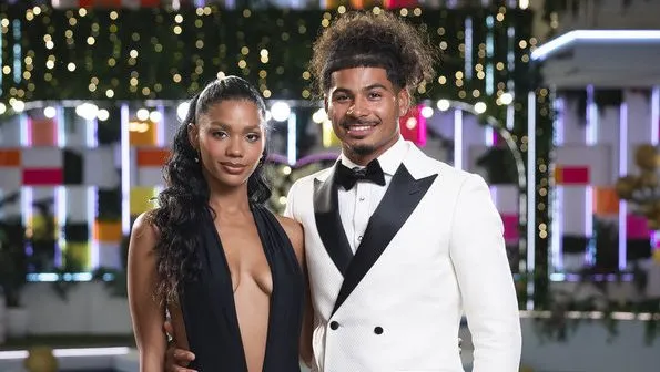 Sincere and Melanie from Love Island USA Season 8 posing during a post-season relationship update.