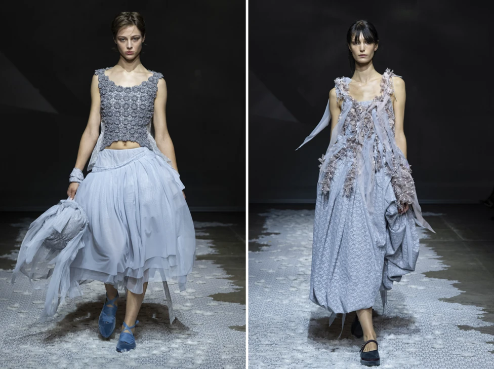 Models walk the runway during the Pauline Dujoncourt Ready to Wear Spring Summer 2027 show as part of the London Fashion Week on September 19th, 2026. They both wear grey floaty long dresses.