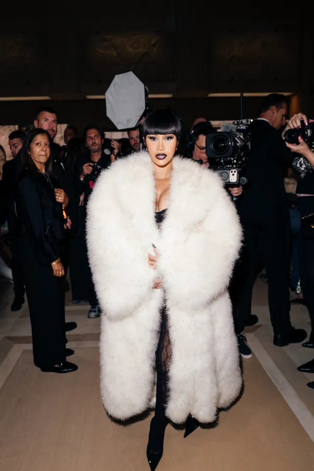 Image may contain Cardi B Robert Kaliňk Person Adult Wedding Clothing Footwear Shoe Face and Head
