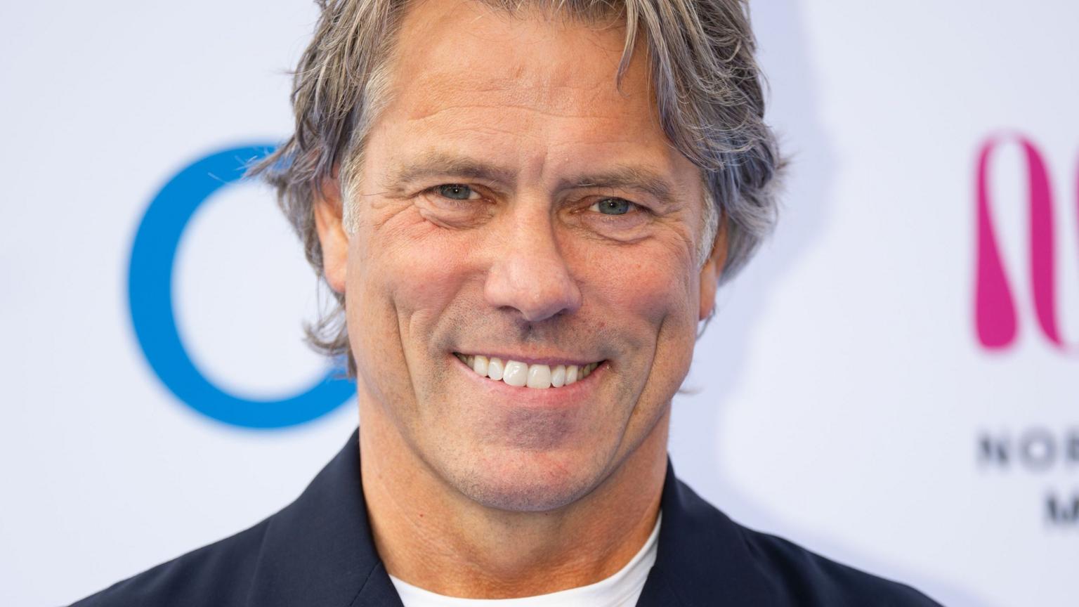 John Bishop attending a red carpet event