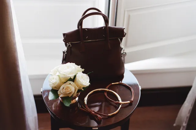 Image may contain Accessories Bag Handbag Flower Plant Rose Purse and Flower Arrangement