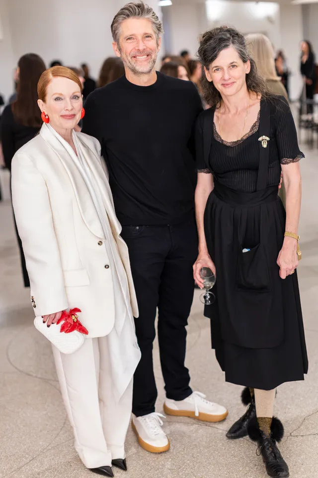 Image may contain Bart Freundlich Julianne Moore Person Adult Photobombing Clothing Coat People Face and Head