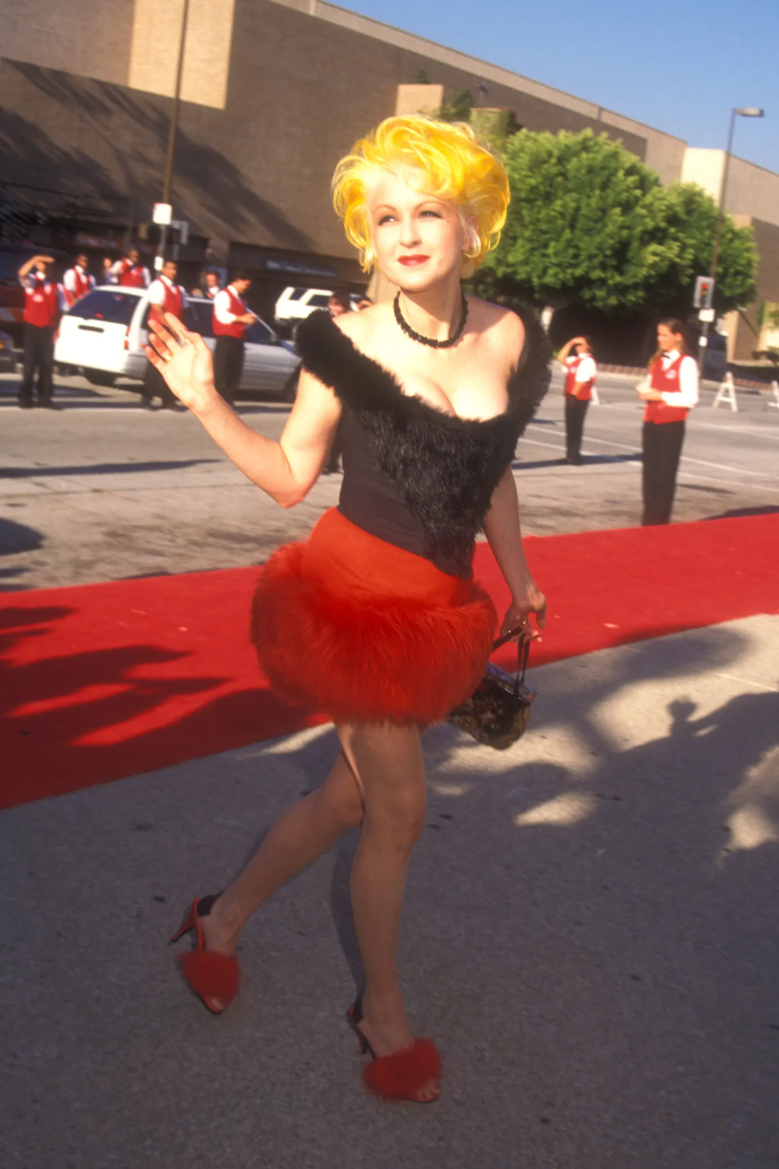 Image may contain Cyndi Lauper Fashion City Road Street Urban Adult Person Clothing Costume Face and Head