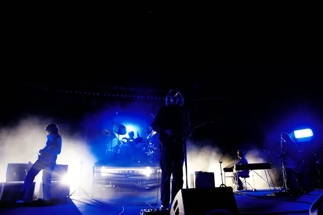 Image may contain Lighting Concert Crowd Person Stage Adult Guitar Musical Instrument Rock Concert and Performer