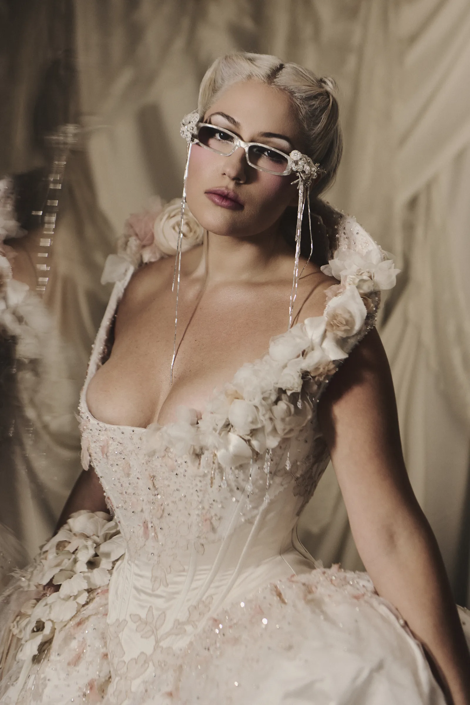 Image may contain Clothing Dress Formal Wear Fashion Gown Wedding Wedding Gown Adult Person Face and Head