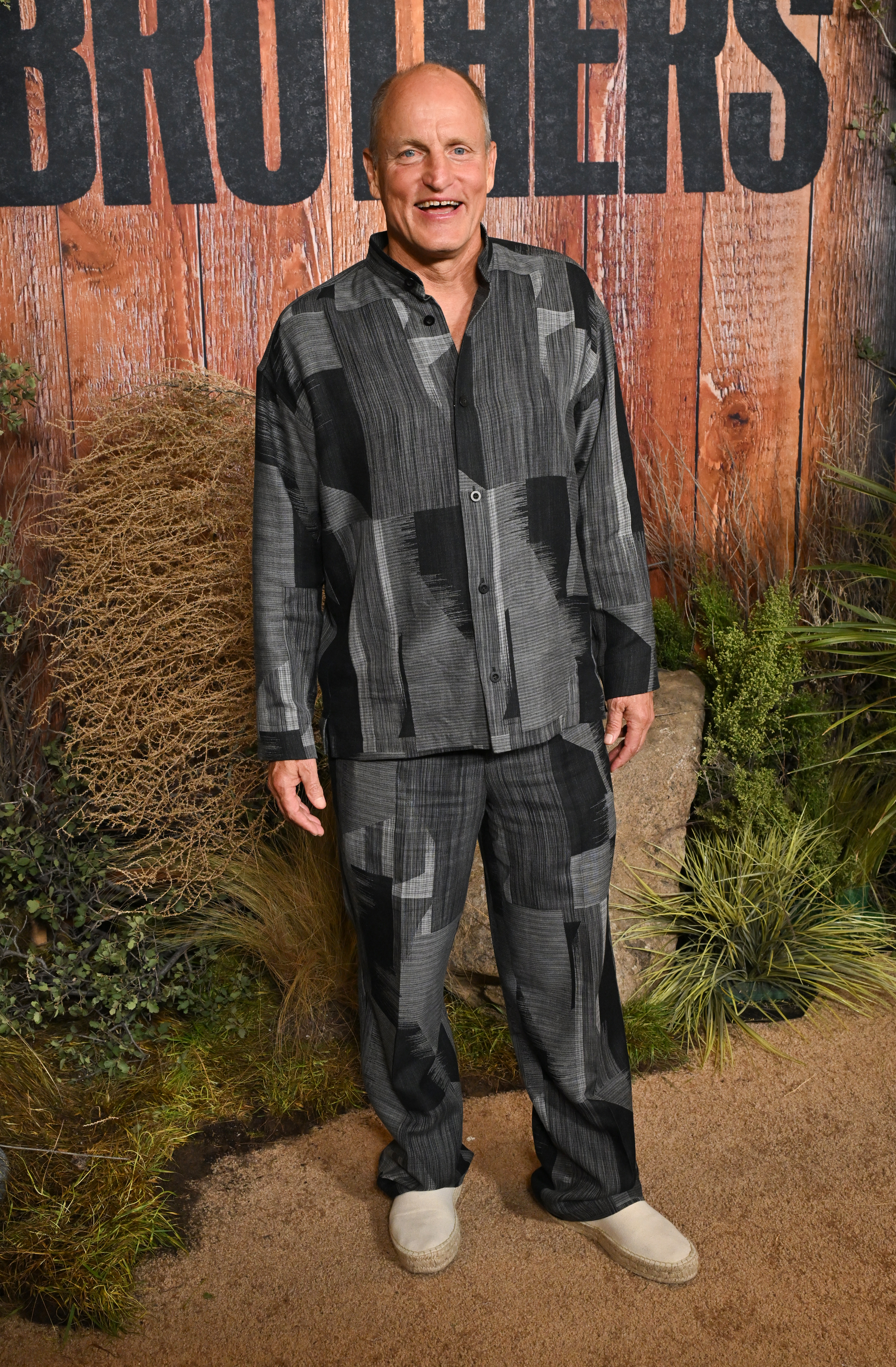 Woody Harrelson smiles at the premiere of Apple TV series "Brothers" in Los Angeles.