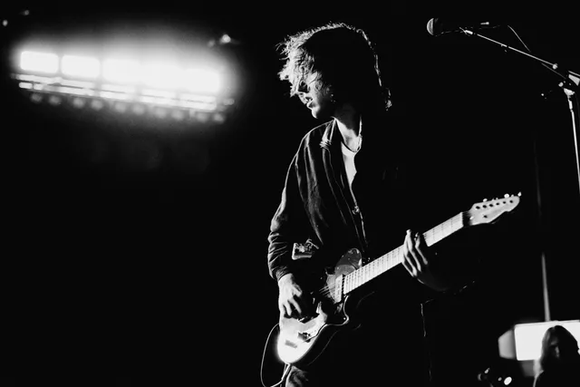 Image may contain Guitar Musical Instrument Person Guitarist Leisure Activities Music Musician and Performer