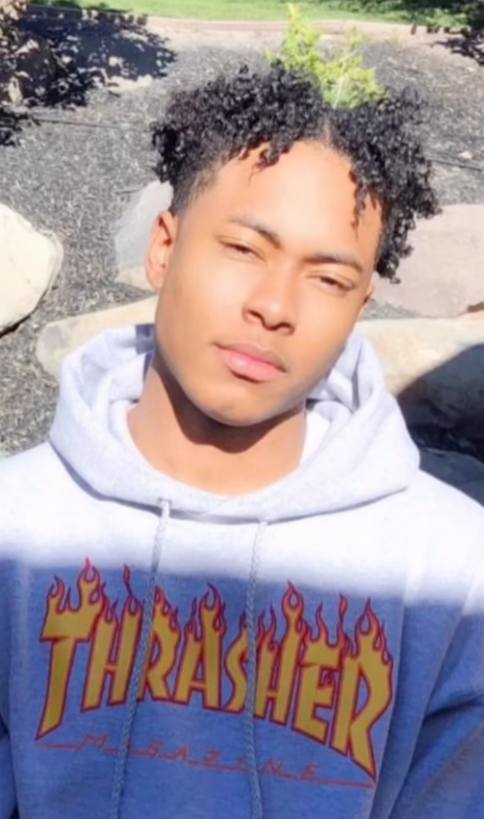 Robert Jr., son of Mary Cosby, wearing a grey "Thrasher" hoodie.