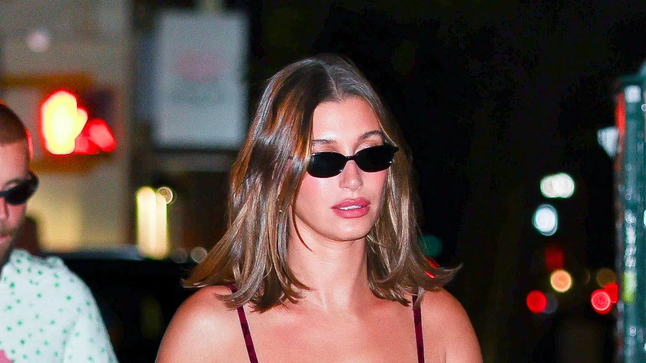 Hailey Bieber showing off her new dark chocolate brown hair for fall.