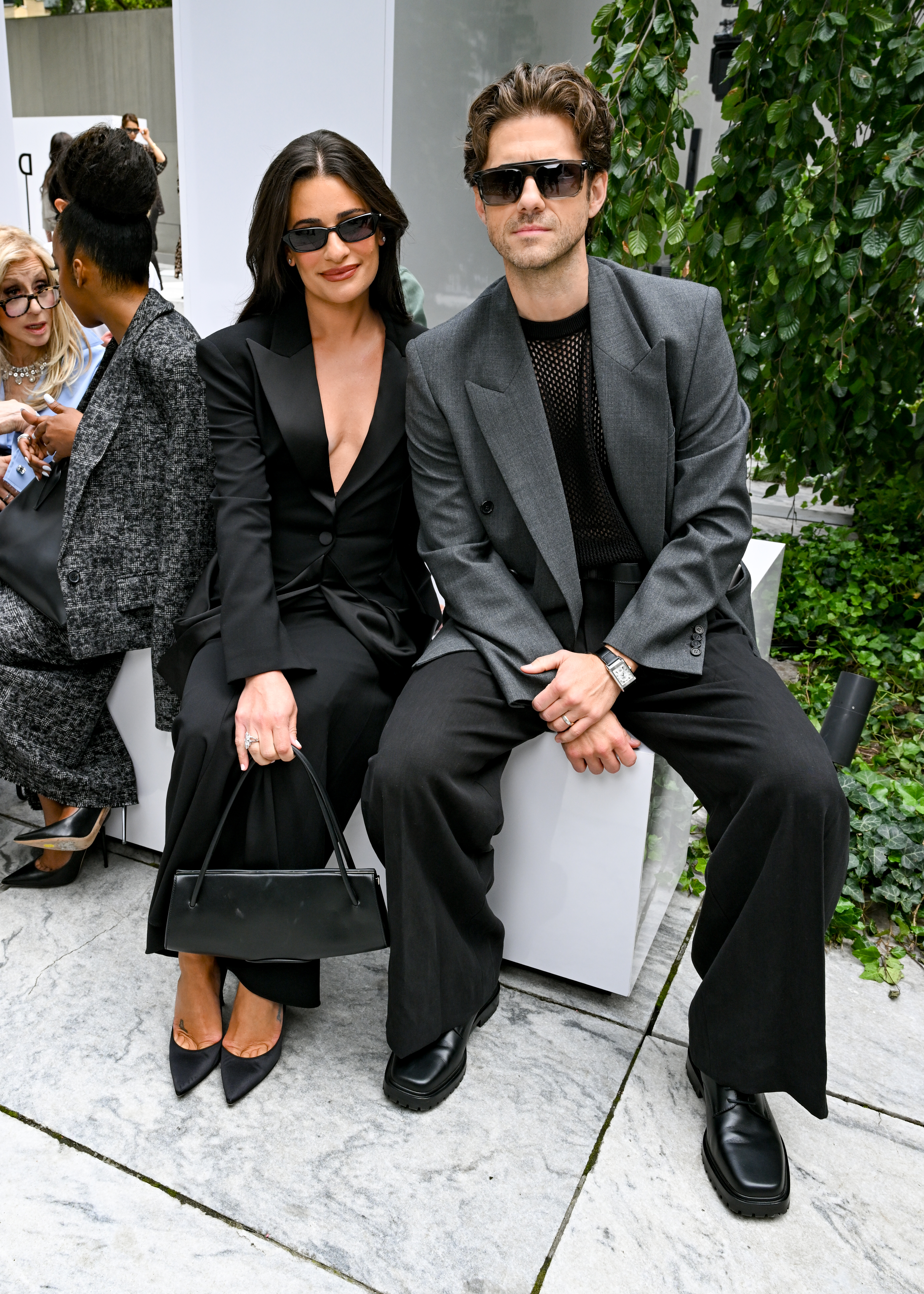 Lea Michele and Aaron Tveit seated at the Michael Kors fashion show.