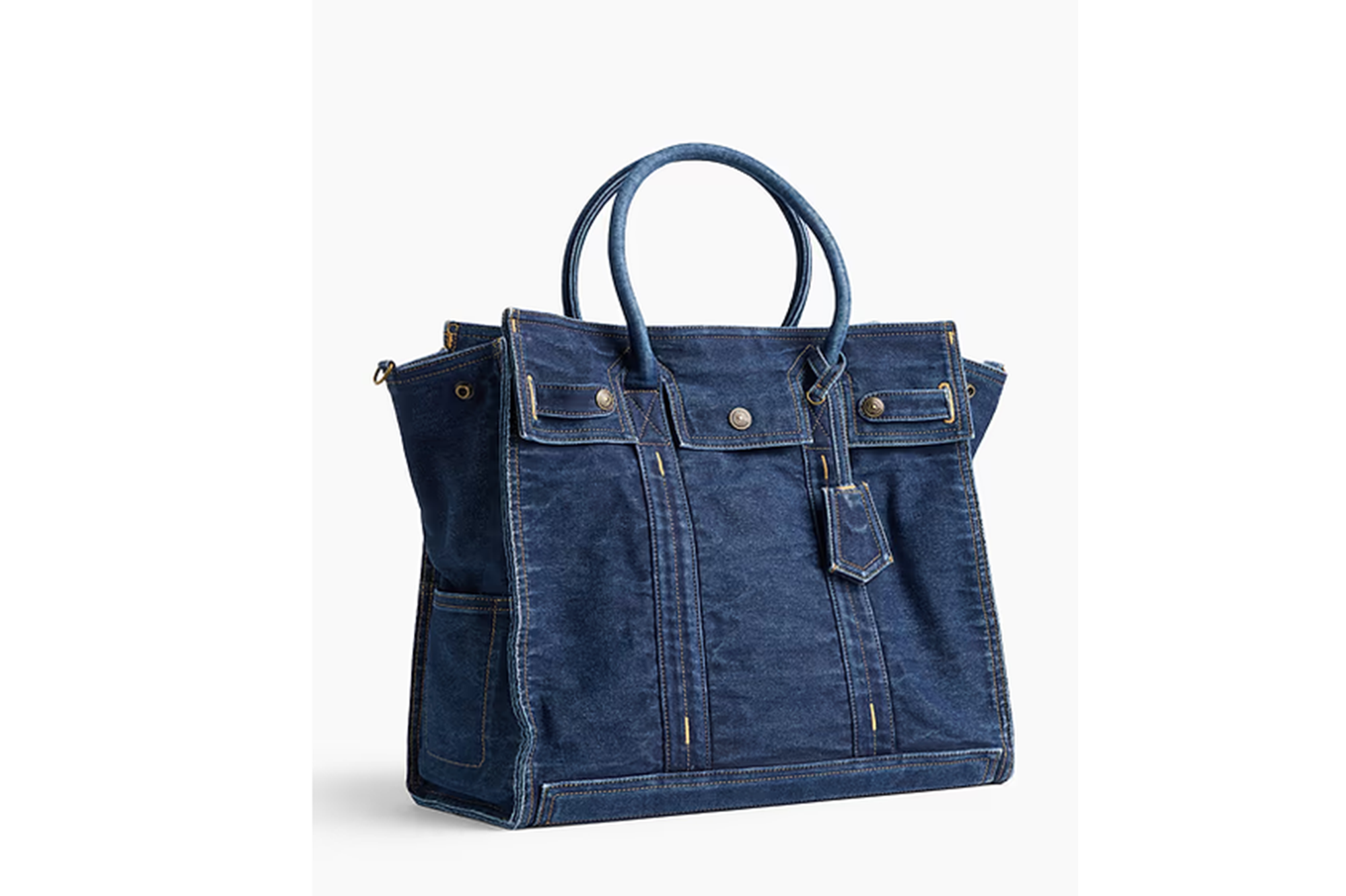 Denim tote bag with double handles and flap pockets.