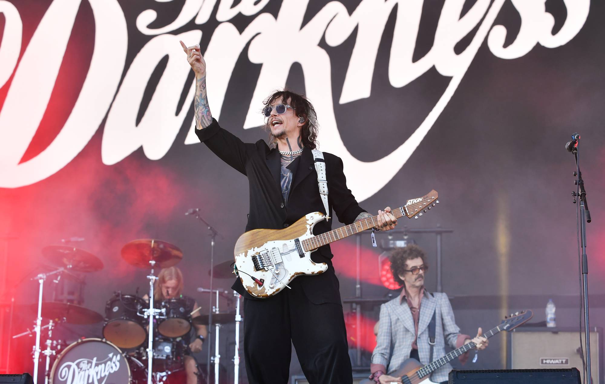 Frontman Justin Hawkins of glam rock band The Darkness performing live on stage