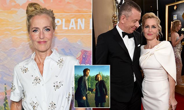 Gillian Anderson posing on a red carpet at a Hollywood event