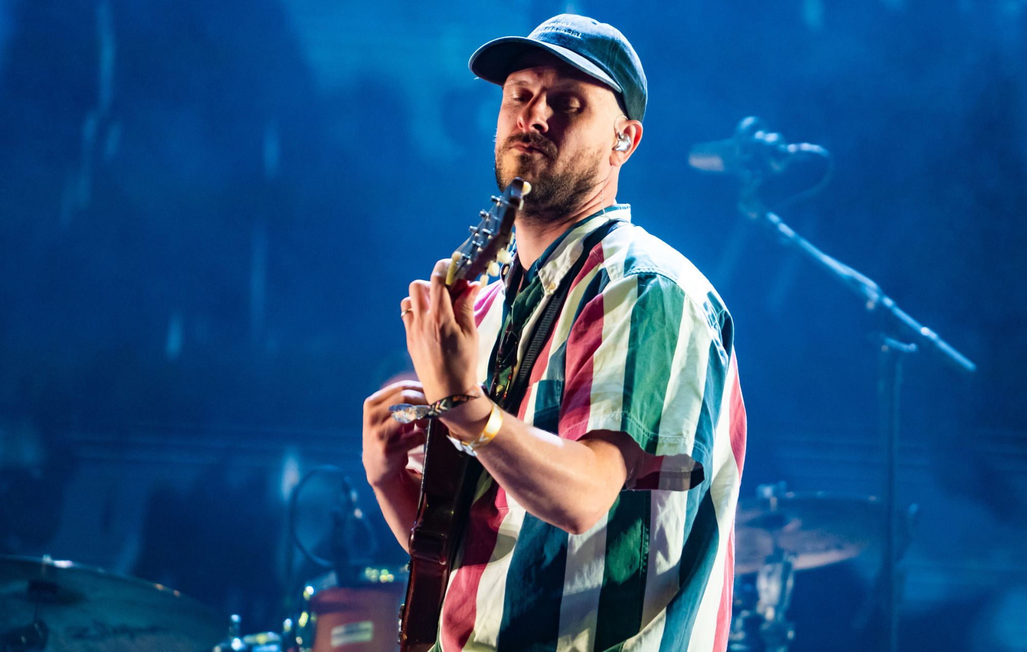 Jamie T performing live on stage at a UK festival set