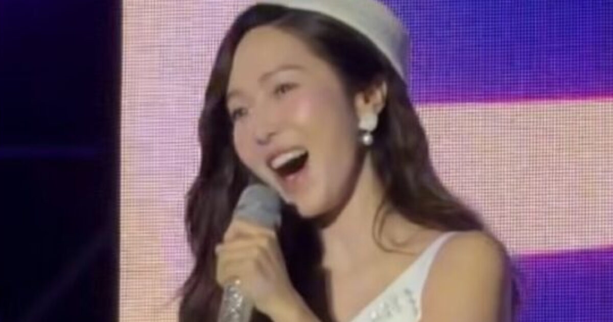 Jessica Jung performing on stage during a surprise reunion event