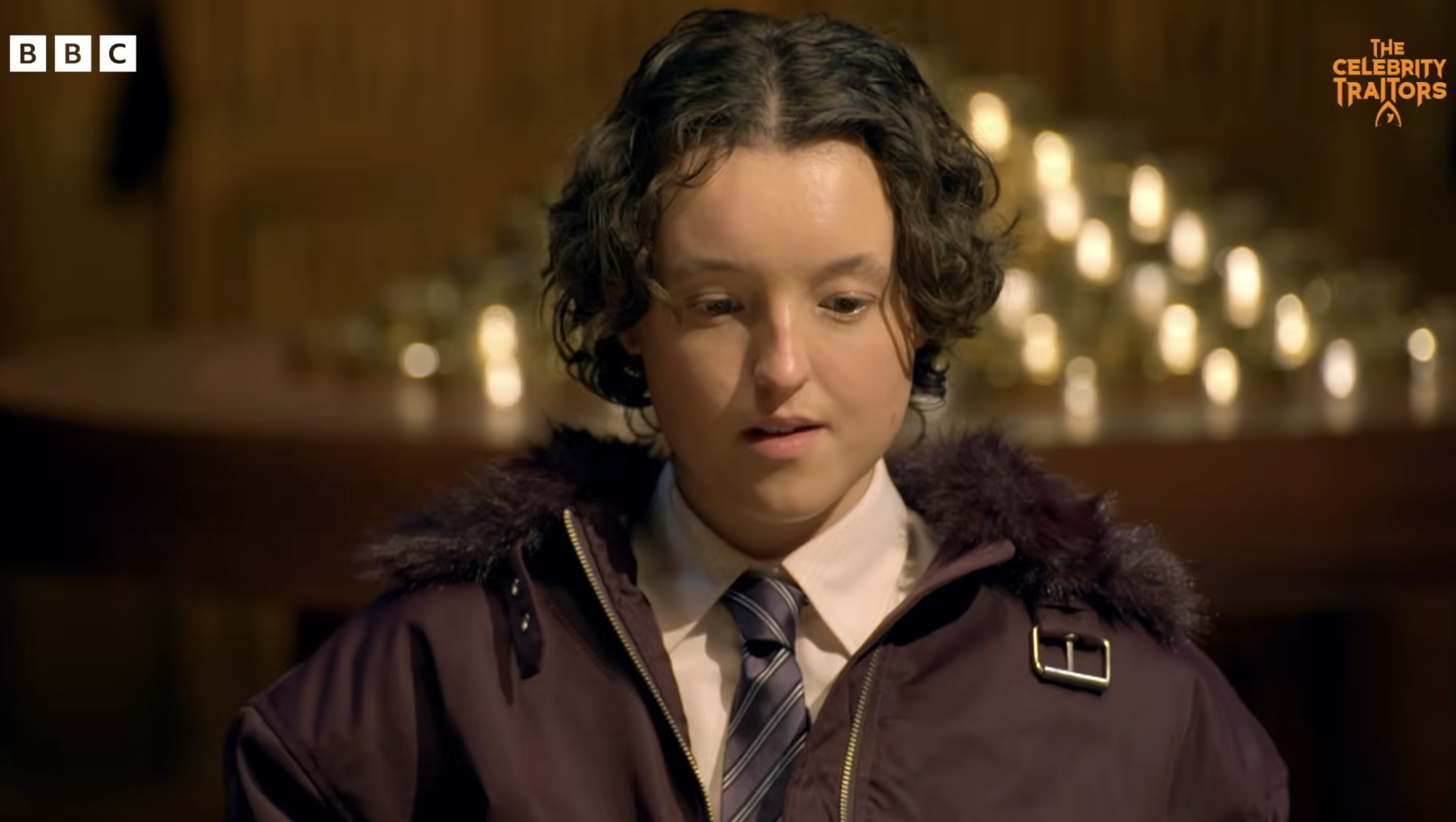 Bella Ramsey and Maya Jama appearing in a trailer for The Celebrity Traitors on BBC