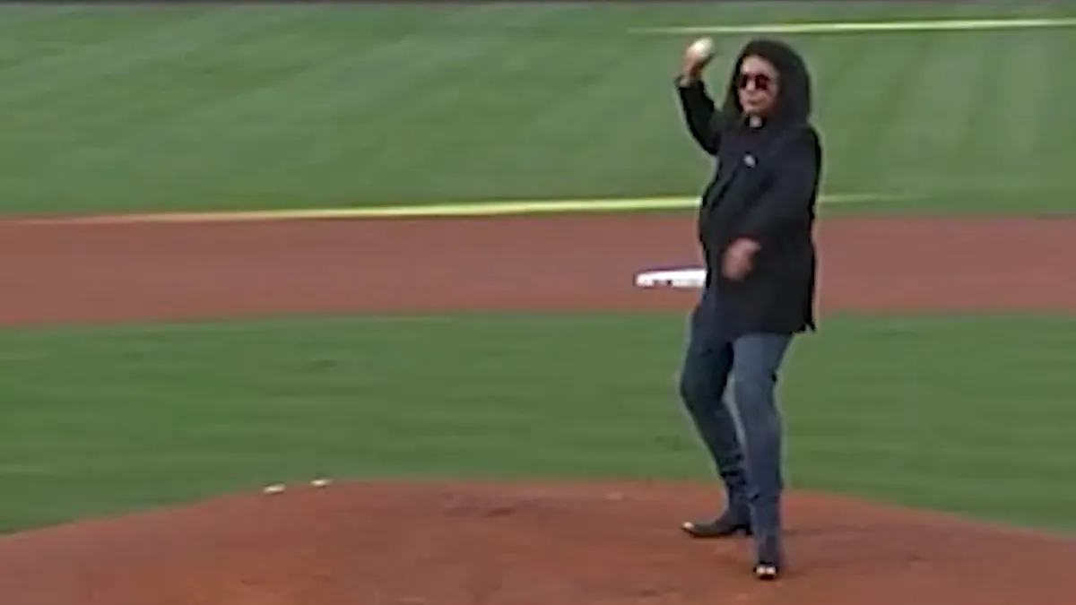 Gene Simmons throwing a baseball on the pitcher's mound at a Los Angeles Angels game
