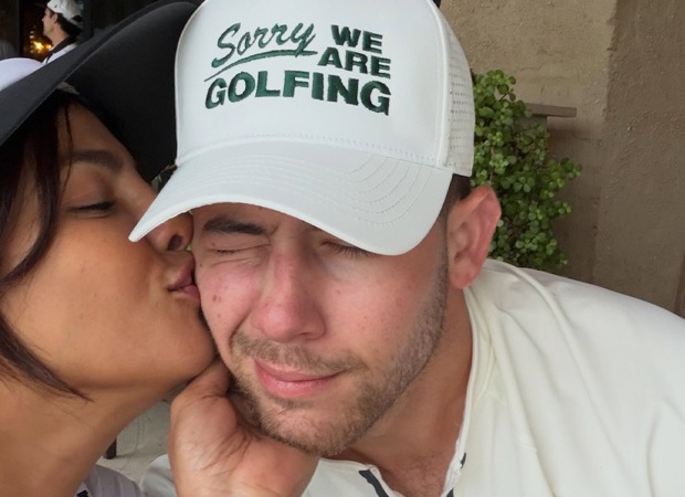 Priyanka Chopra and Nick Jonas posing together at a family event
