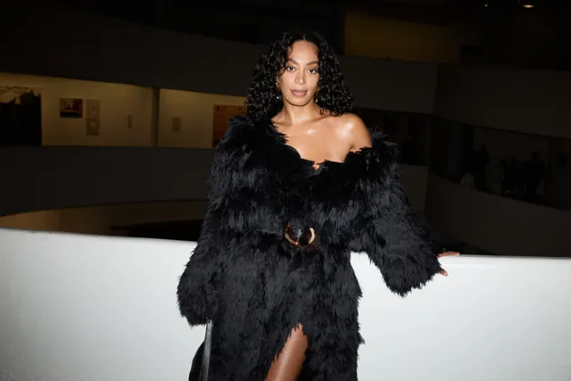 Image may contain Solange Adult Person Clothing Coat Fur Face Head Black Hair and Hair