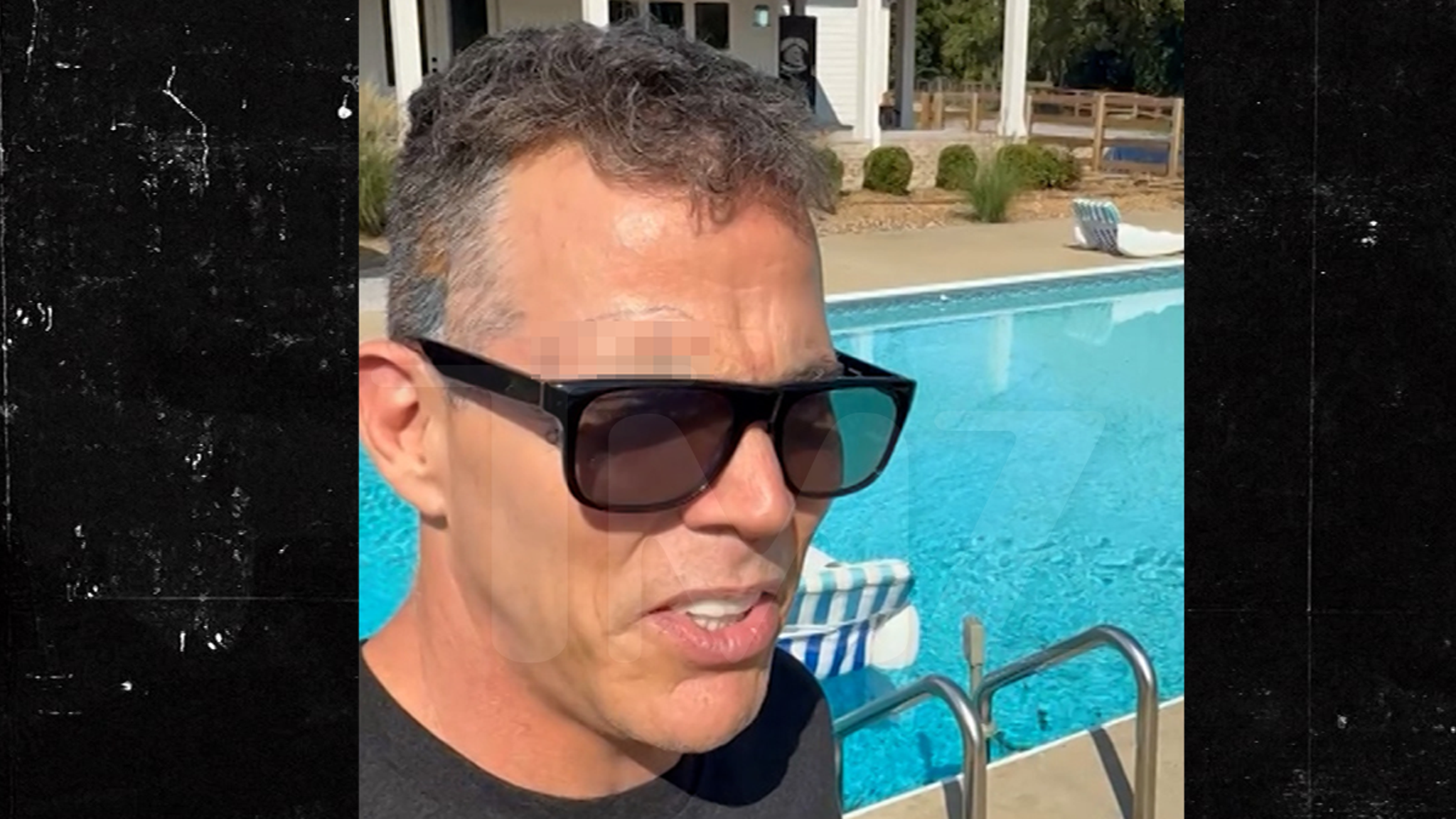 Steve-O smiling outdoors near his property