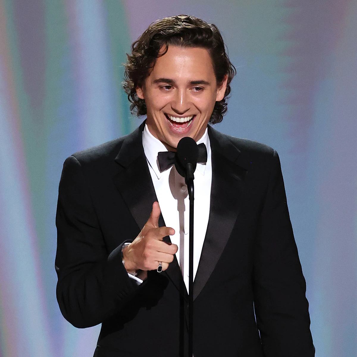 Marcello Hernandez speaking on stage at the Emmy Awards.