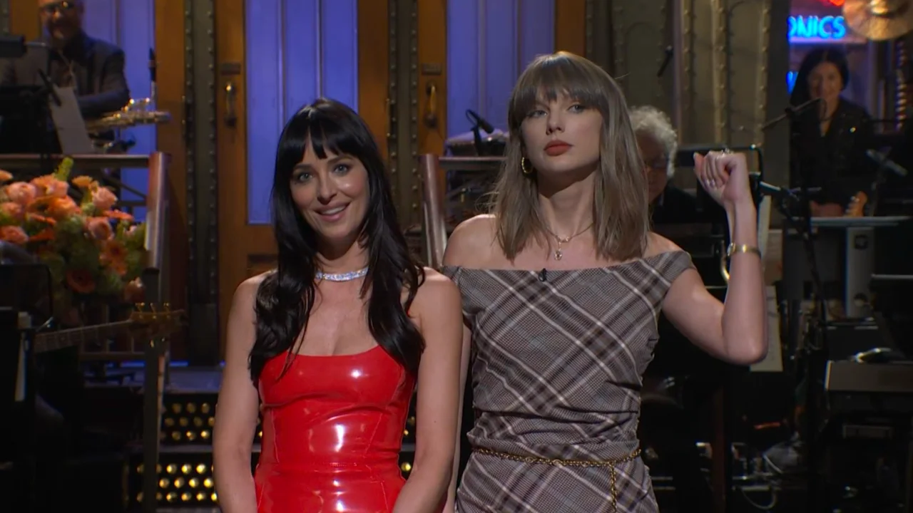 Taylor Swift Interrupts Dakota Johnson’s ‘SNL’ Monologue With Breakup Advice