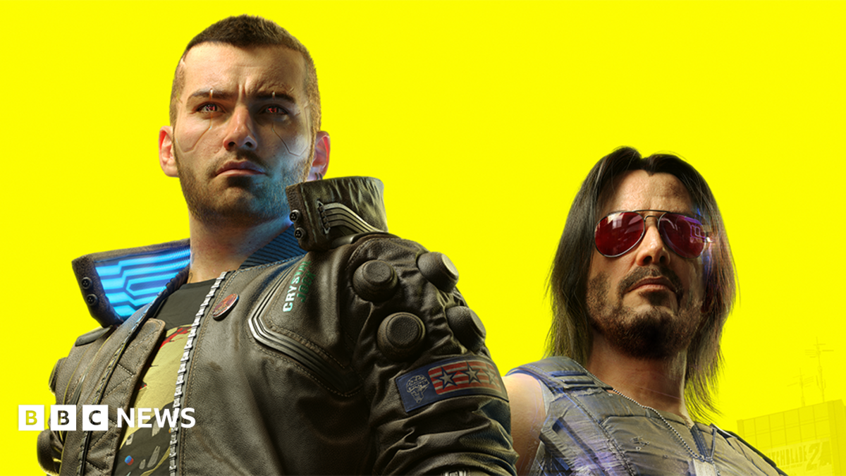 Artwork from Cyberpunk 2077 shows player character V - a shaven-headed male wearing a leather jacket over a graphic t-shirt. He's standing next to Johnny Silverhand, who bears the likeness of Keanu Reeves. He's